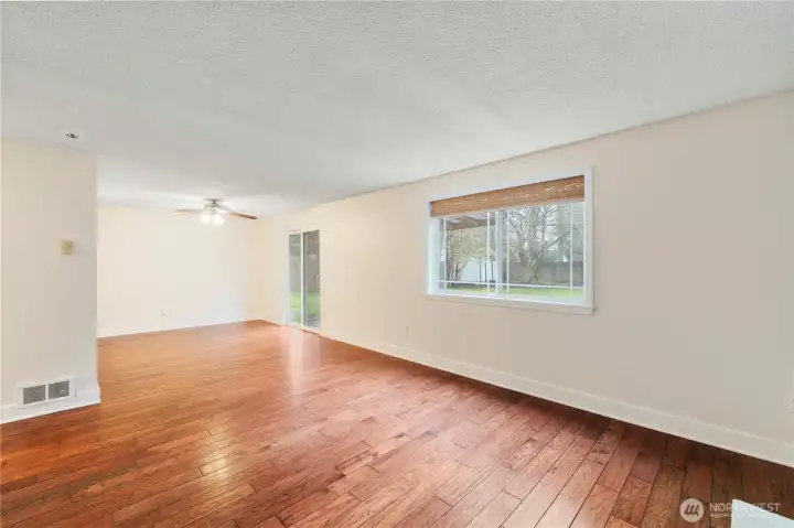 The dining room features a sliding door that opens to the backyard, great for indoor-outdoor living and entertaining. Bring the BBQ!