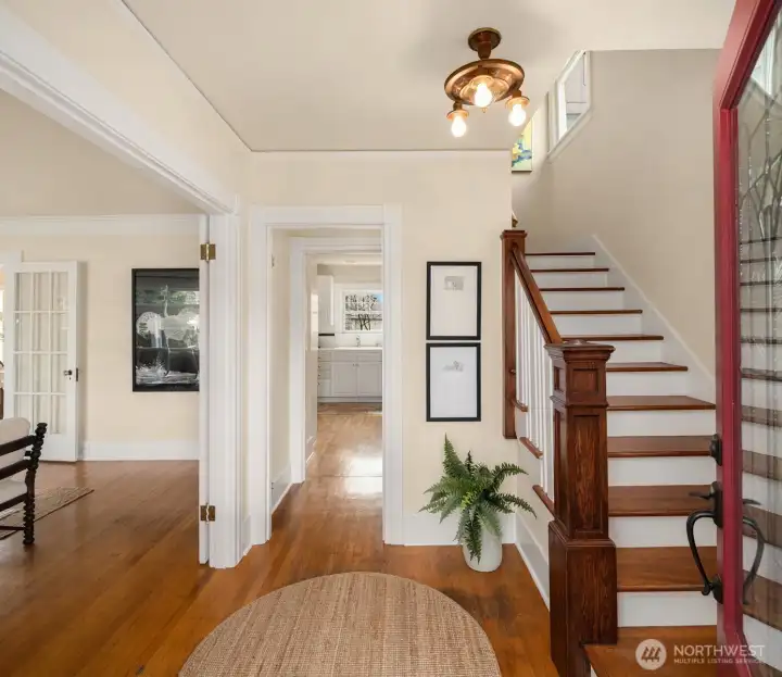 Rich with original character, this beautiful home showcases top-nail oak hardwood floors, crown moulding, and vintage light fixtures.
