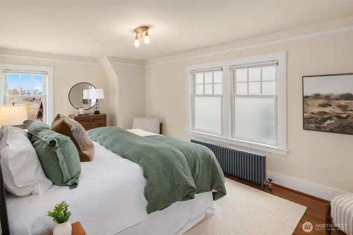 Spacious primary bedroom with king bed.