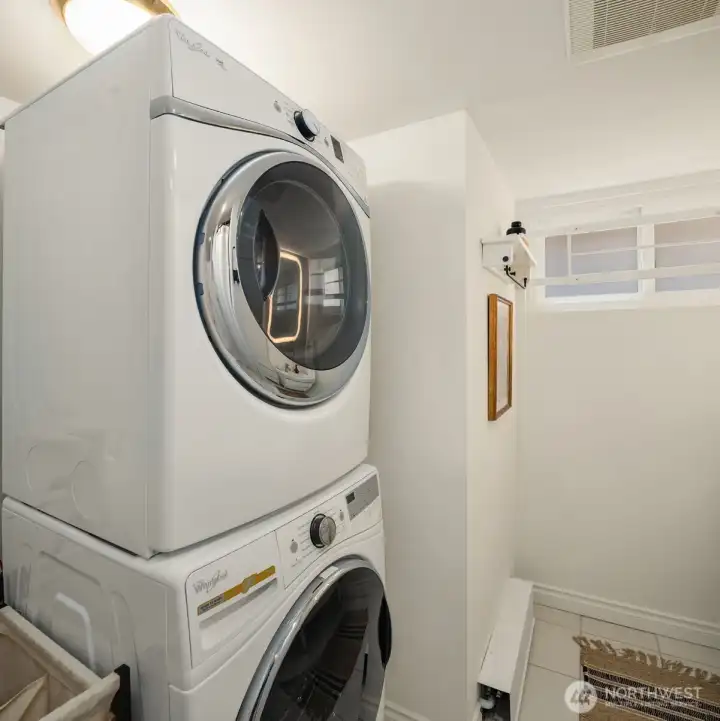 Laundry located in lower-level bathroom.
