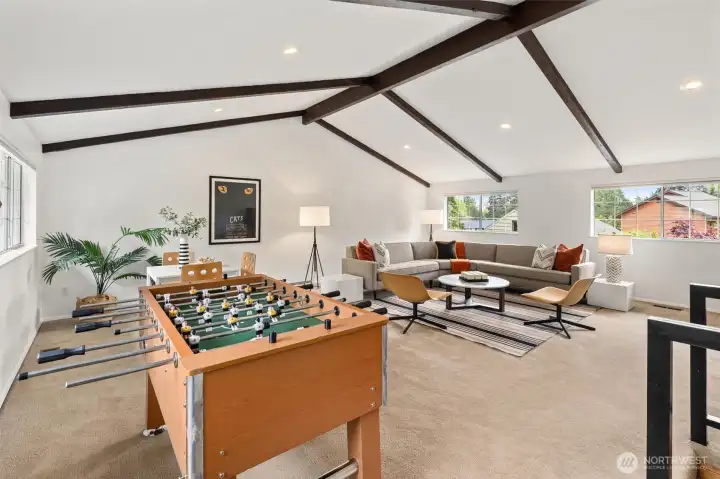 vaulted bonus room creates the perfect flex space for media room, playroom or work out space