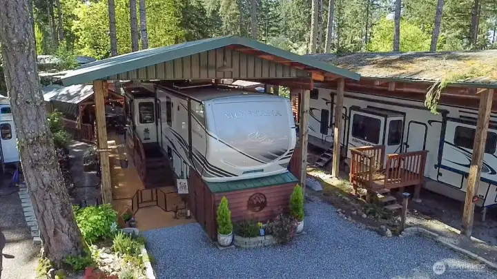 20 HEMLOCK RV SITE /POLE BARN COVER WITH 2 SHEDS WASHER/DRYER.  RV FOR SALE SEPARATE FROM THE OWNER!   DECKING ALL THE WAY BACK TO PORCH AREA AND SHED