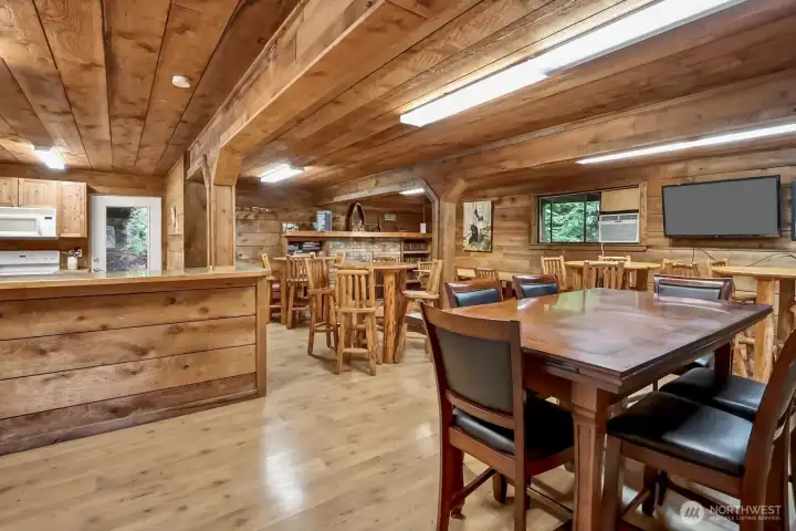INSIDE THE CLUBHOUSE WITH FULL KITCHEN, TABLE AND CHAIRS