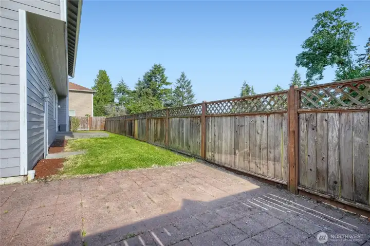 Large patio in back yard - perfect for the grill and summer barbeque!