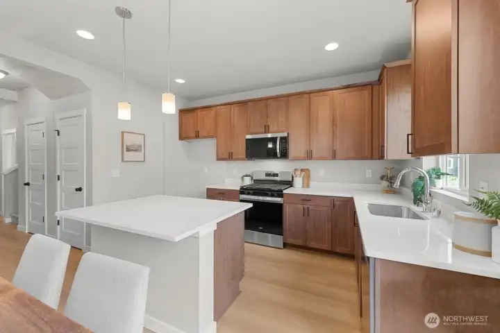 Image is a rendering. Photographs are for illustrative purposes only. Features, finishes, interior/exterior colors, landscaping and floorplan shown may vary from actual homes built