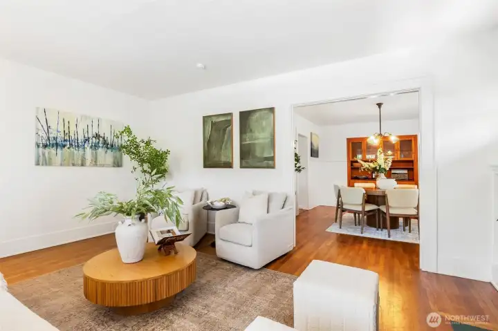 This living room flows seamlessly into the formal dining area, perfect for effortless entertaining.