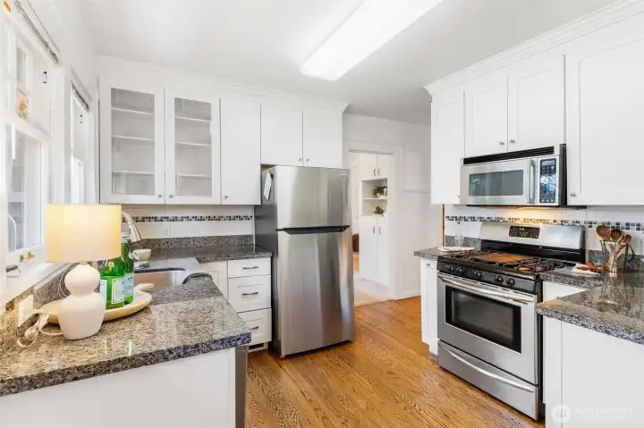 Updated kitchen with tile backsplash.