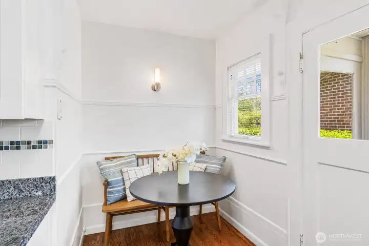 Bright, inviting breakfast nook featuring natural light and a cozy atmosphere.