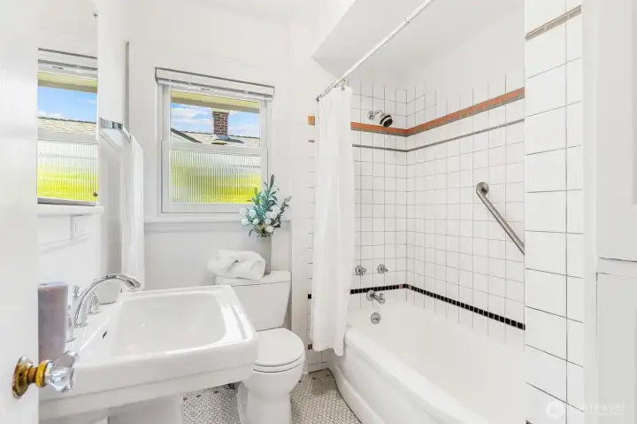 Bright full bathroom located on the main floor.