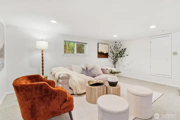 From spacious great room-open door into an unfinished area, offering endless possibilities for customization and expansion.