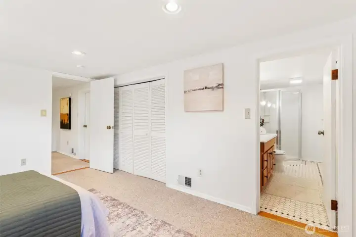 Spacious basement bedroom featuring a private, 3/4 bathroom.