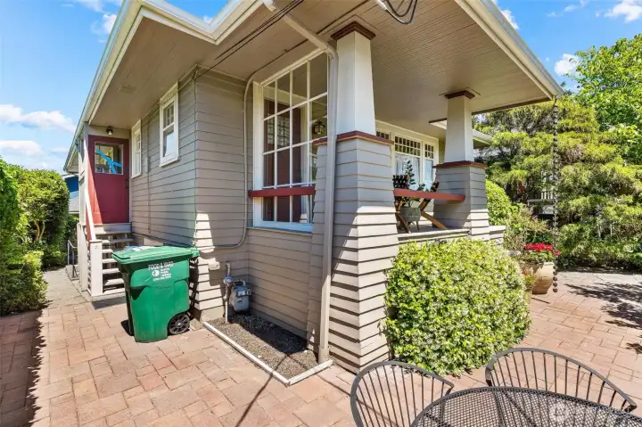 Spacious outdoor patio with convenient access to the garage and side yard.