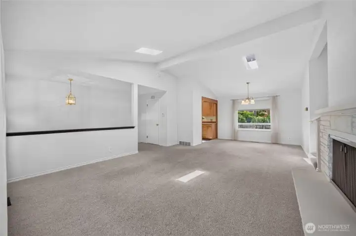 Living room has vaulted ceilings and skylights Living room has vaulted ceilings and skylights