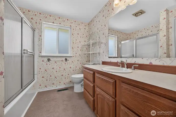 Hallway full bathroom with tub and shower Hallway full bathroom with tub and shower