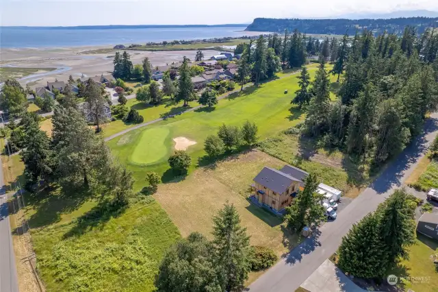 Rare level golf course front lot just steps to beach