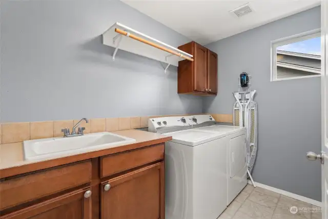 Nicely appointed laundry room with utility sink!