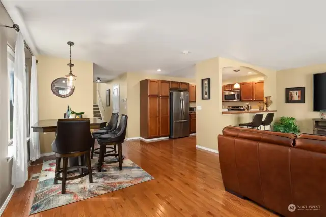 Convenient layout of downstairs living area encompasses the kitchen, dining, and family room.  There's a 1/2 bath to the left in the hallway for personal and guest convenience.