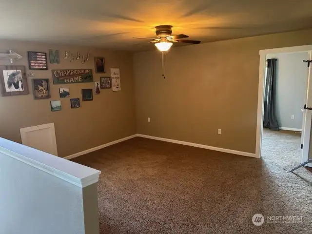 Upstairs TV room. Bedroom door in background.