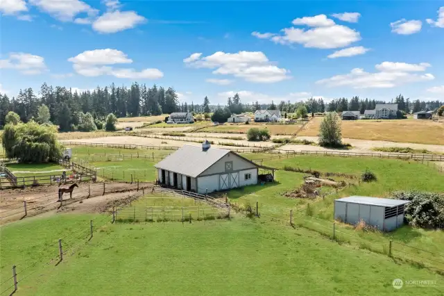 Barn - Has 3 stalls, tack room, extra storage room and Loft for Hay - Loft has a hay elevator.