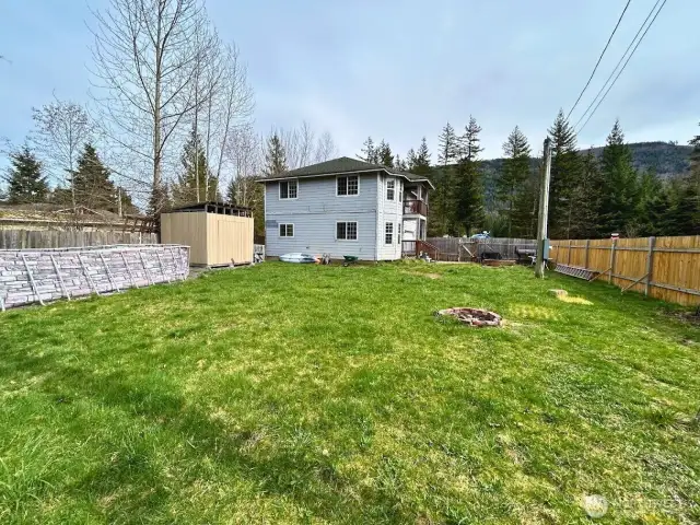 Large fully fenced yard with above ground swimming pool
