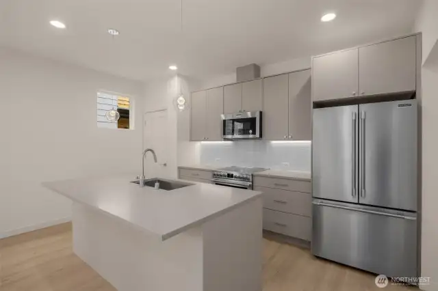 Chic and spacious—this kitchen brings the function and the vibe with designer finishes and a layout built for gathering.