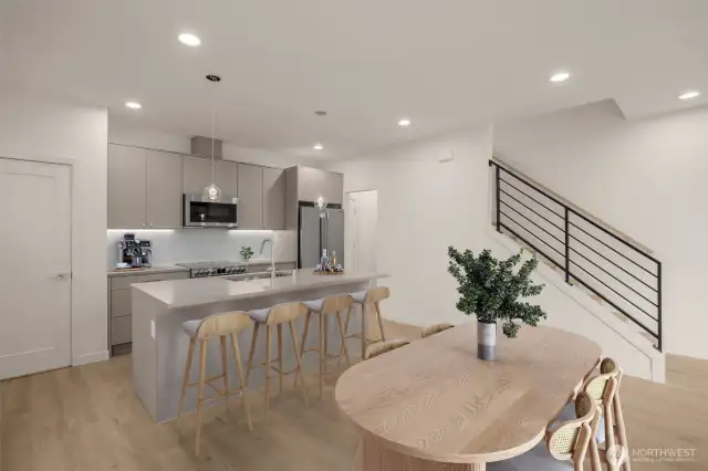 This image is virtually staged. The perfect flow from kitchen to living area—whether you’re entertaining or relaxing, this open-concept layout has it all.