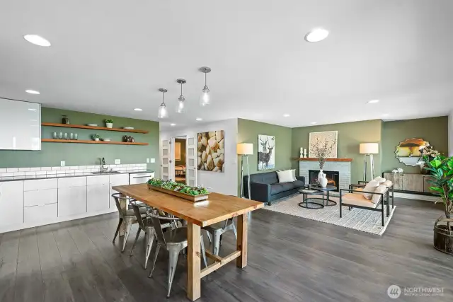 The kitchen, dining, and living room are all open with new flooring and radiant in floor heat.