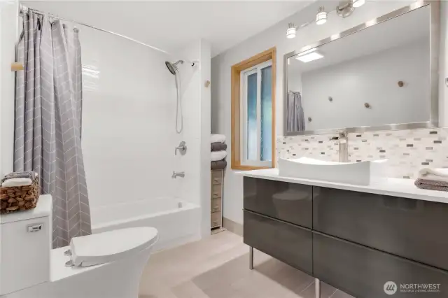 Large remodeled bathroom with full-size laundry!