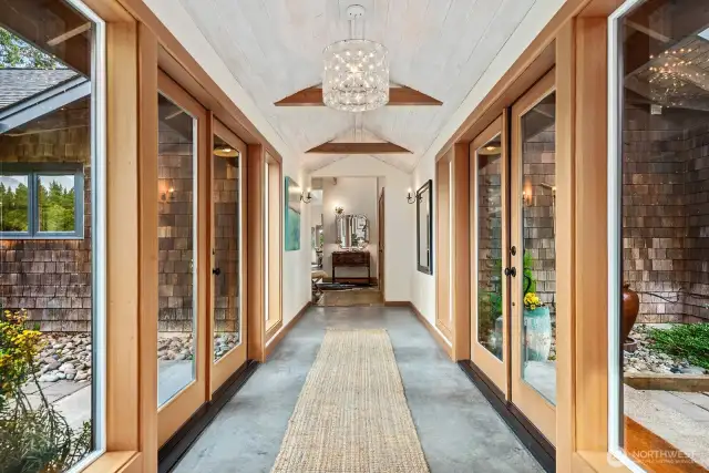 This glassed breezeway connects three wings of Euroinspired design and functionality.