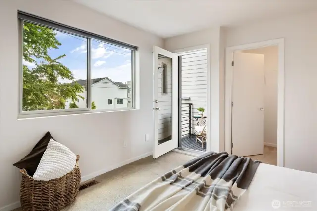 Another look at first bedroom with private sitting deck and closet.