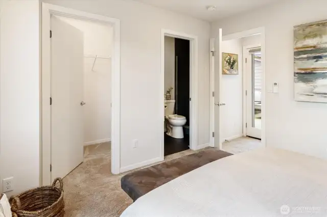 Primary bedroom features a large walk in closet and bathroom.