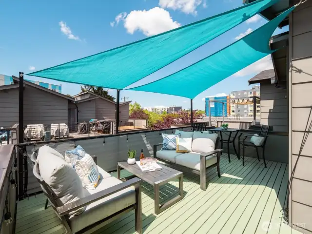 Sunny rooftop deck access from the third floor.
