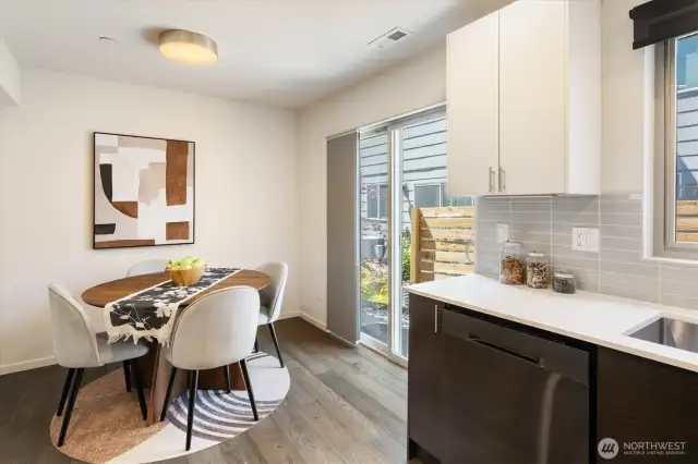 Dining area off the kitchen and sliding doors to outside patio.