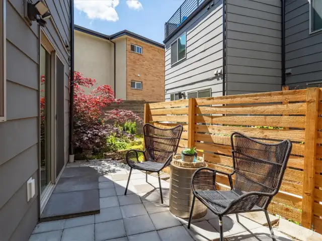 Paved patio with privacy fence. Great spot for a BBQ!
