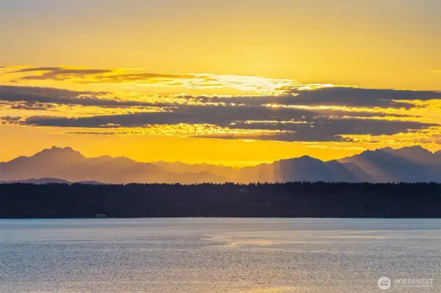 Glowing sunsets over the Olympics + Vashon & Maury islands across the Salish Sea.