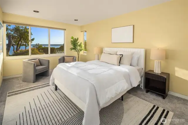 This bedroom enjoys privacy + garden/water views.