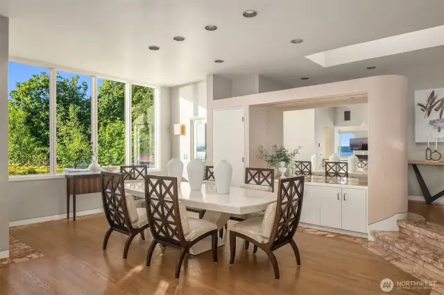 The dining room area opens onto another deck overlooking breathtaking views of Three Tree Point.