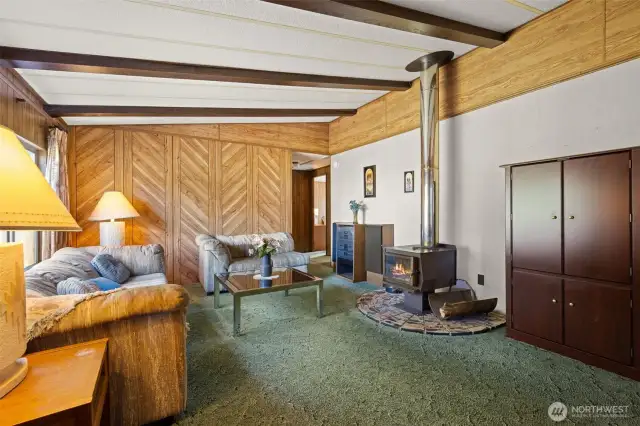 Front door opens to great room with cozy wood fireplace.
