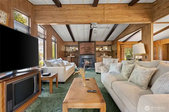 Large living room with back yard access out the sliding doors.