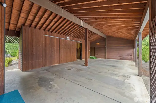 Inside the carport and door open to the 784sqft Shop