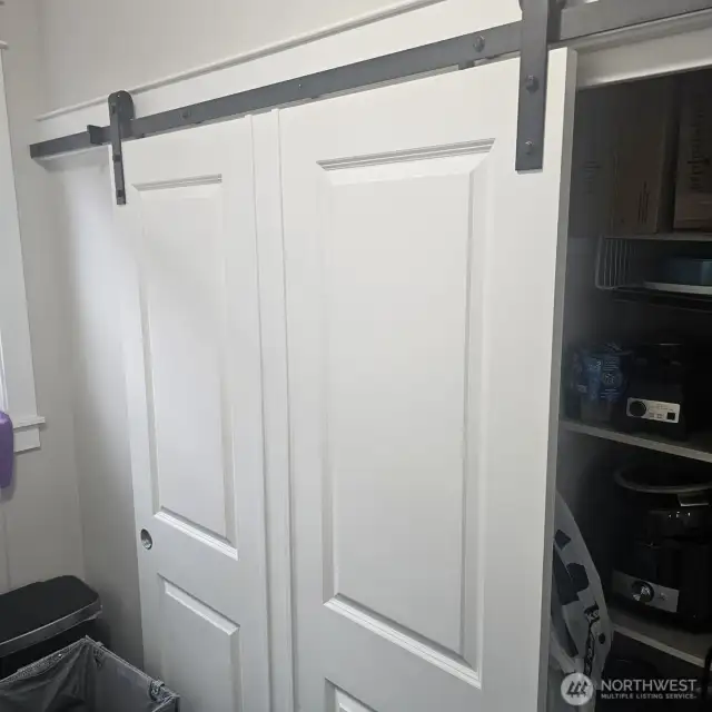 barn door for the pantry in the laundry room