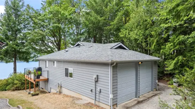 Side view of garage. It has windows and a utility sink