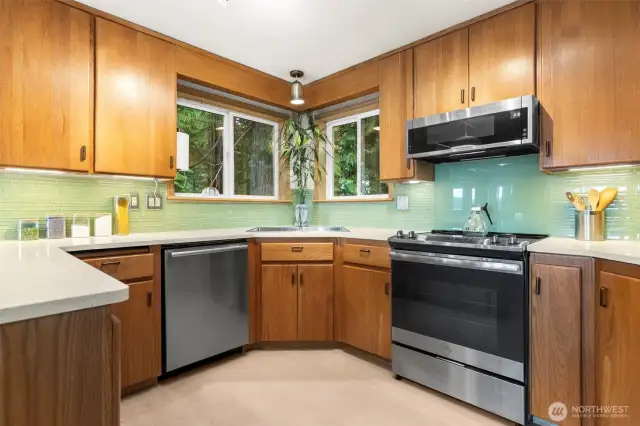 Kitchen with new LVP flooring, great airflow and enough counter space for multiple cooks