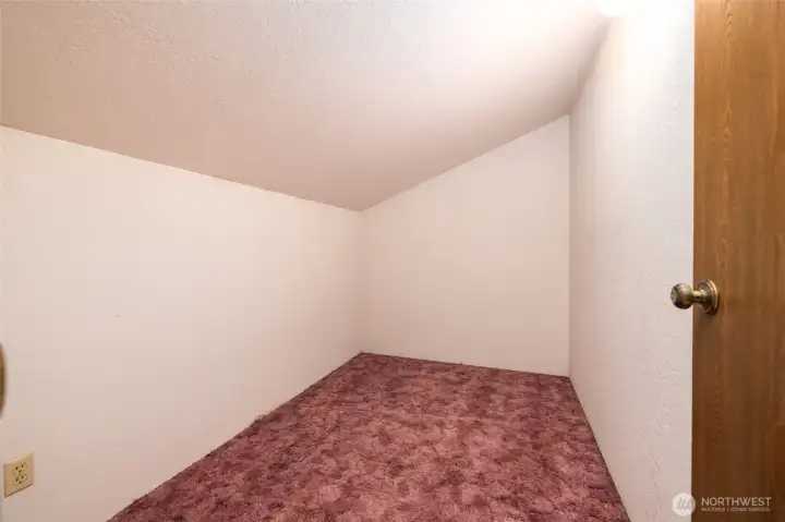 Storage room off full bath on upper level