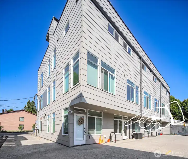 Rear entry in back driveway, parking to the right.