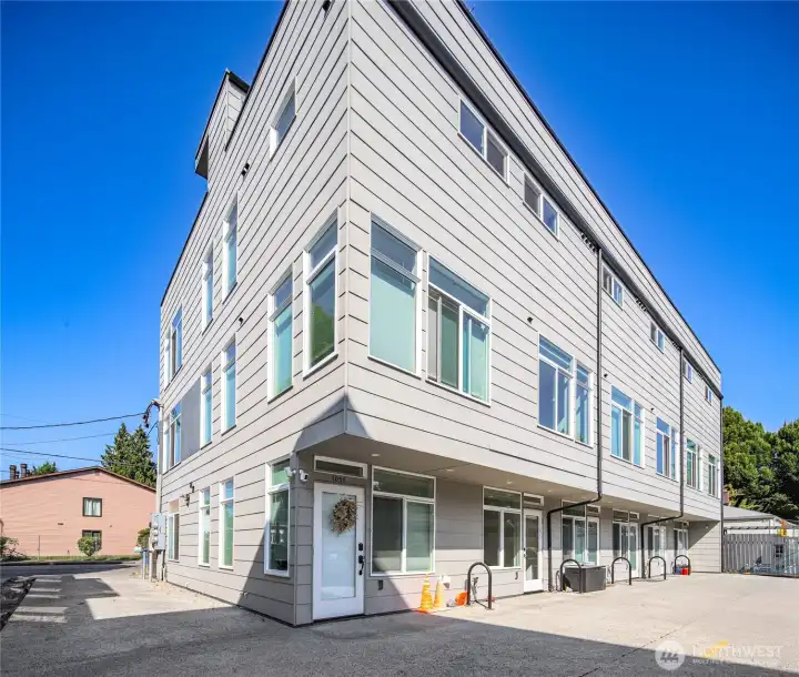 Rear entry in back driveway, parking to the right.