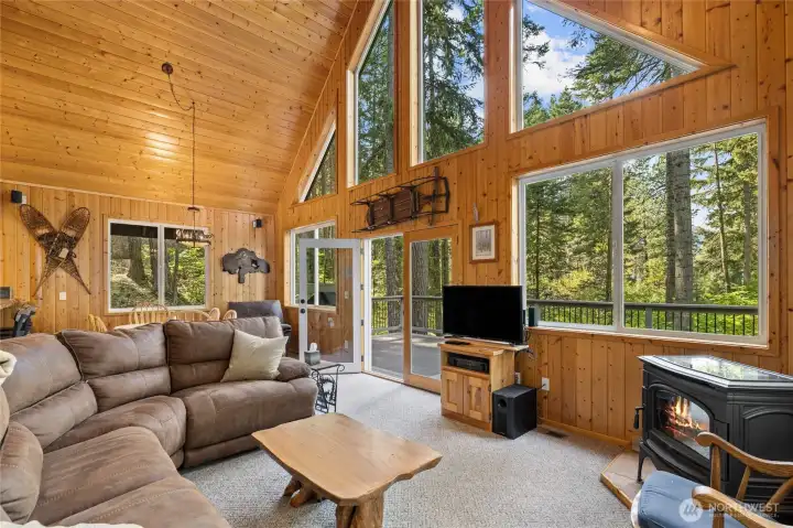 Window wall and french doors bring outdoors in.