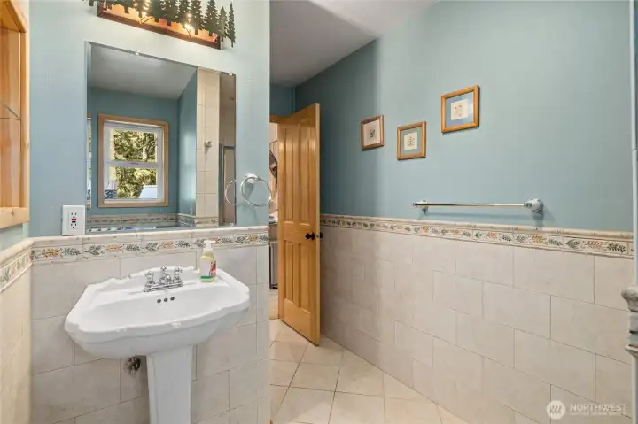 Extensive custom tile work in main floor 3/4 bath.