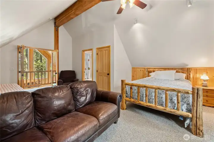 Primary suite offers potential sleeping loft for many guests.