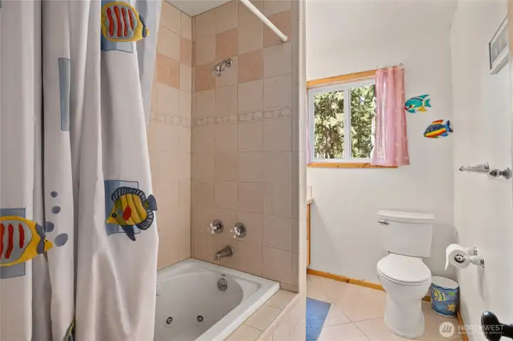 Primary bath boasts jetted tub for added relaxation! More custom tile finishes!